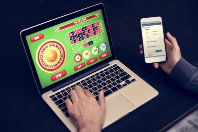hand-holding-credit-card-playing-online-gambling-2023-11-27-05-16-00-utc